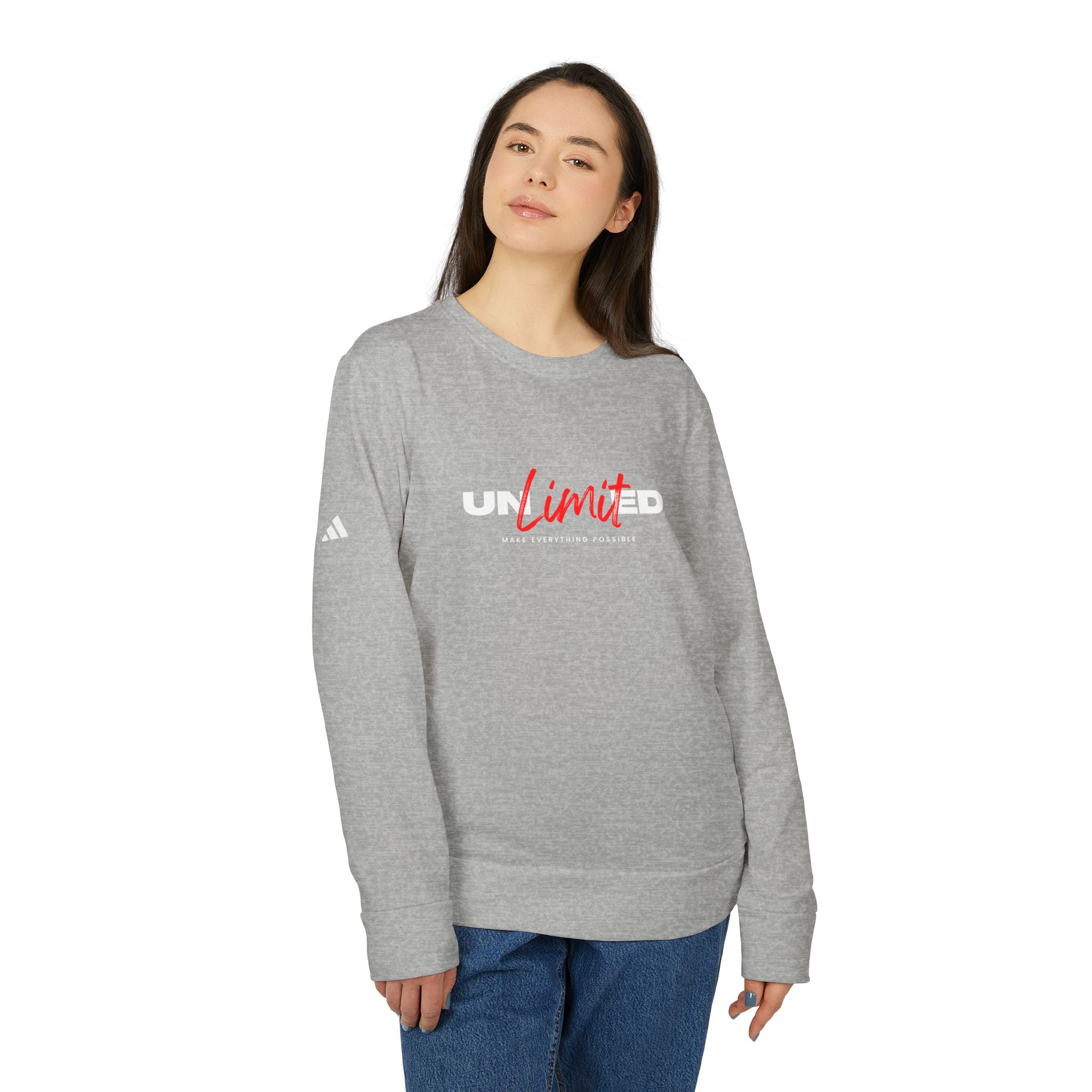 Person wearing a gray sweatshirt with 'UNLIMTED' text and Adidas logo on a white background