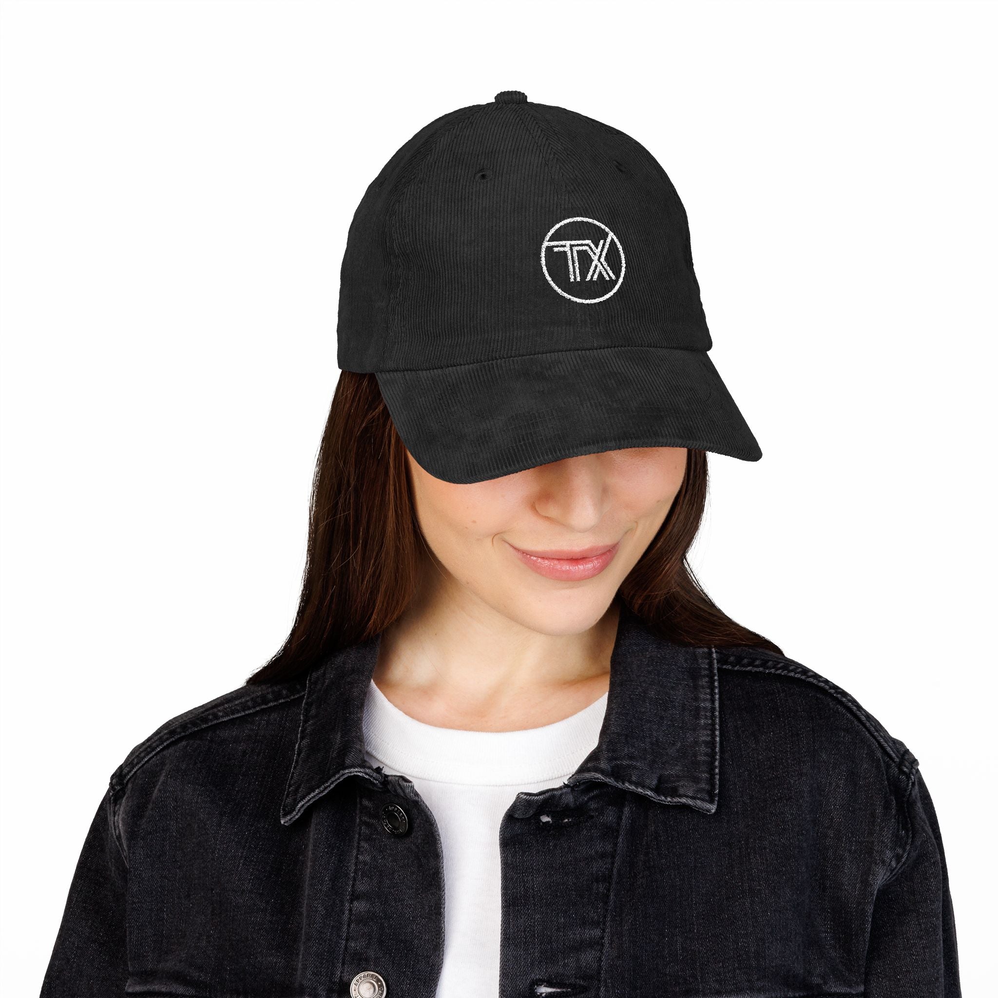 Person wearing a black cap with a logo on a white background
