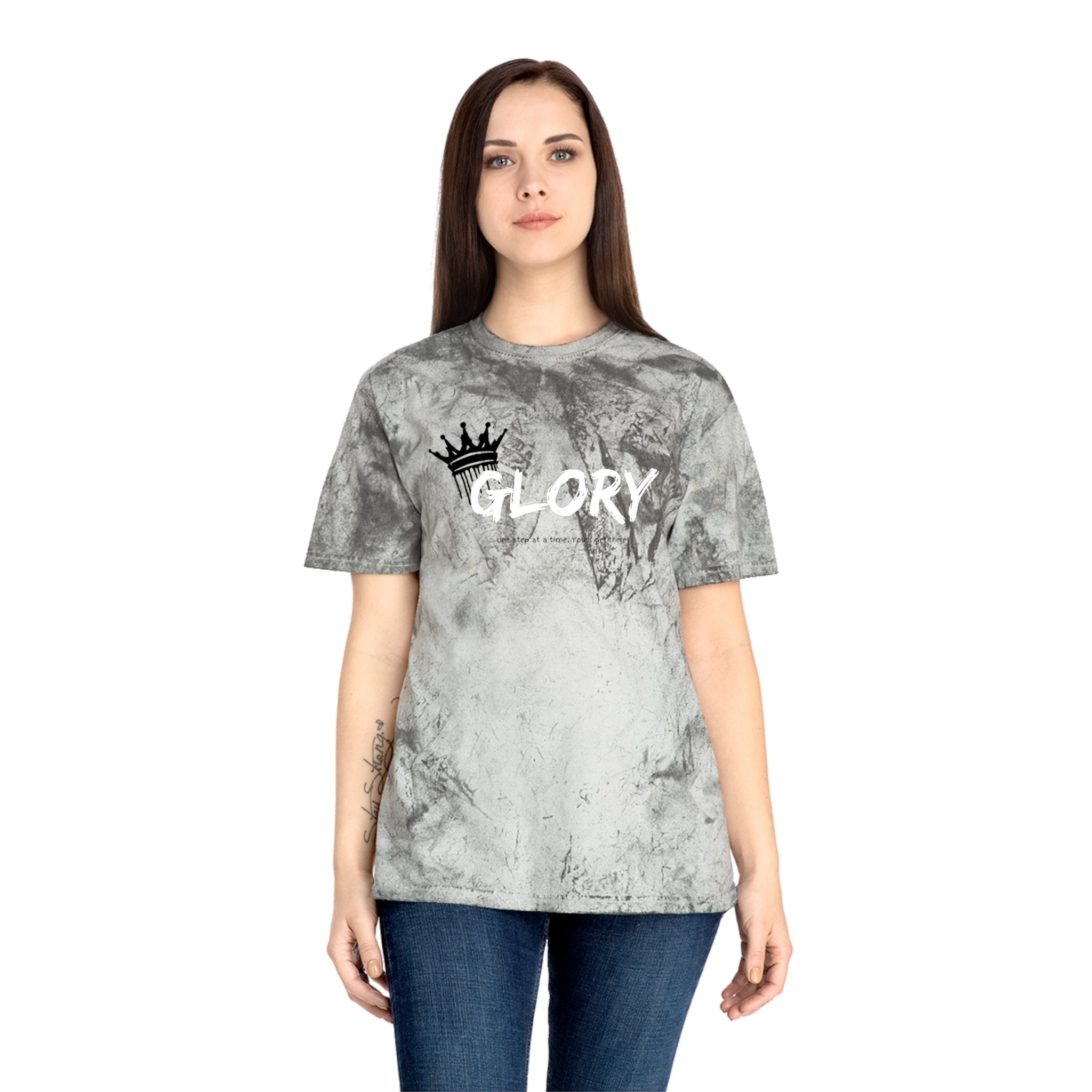 Person wearing a gray tie-dye t-shirt with 'GLORY' text and crown graphic on a white background