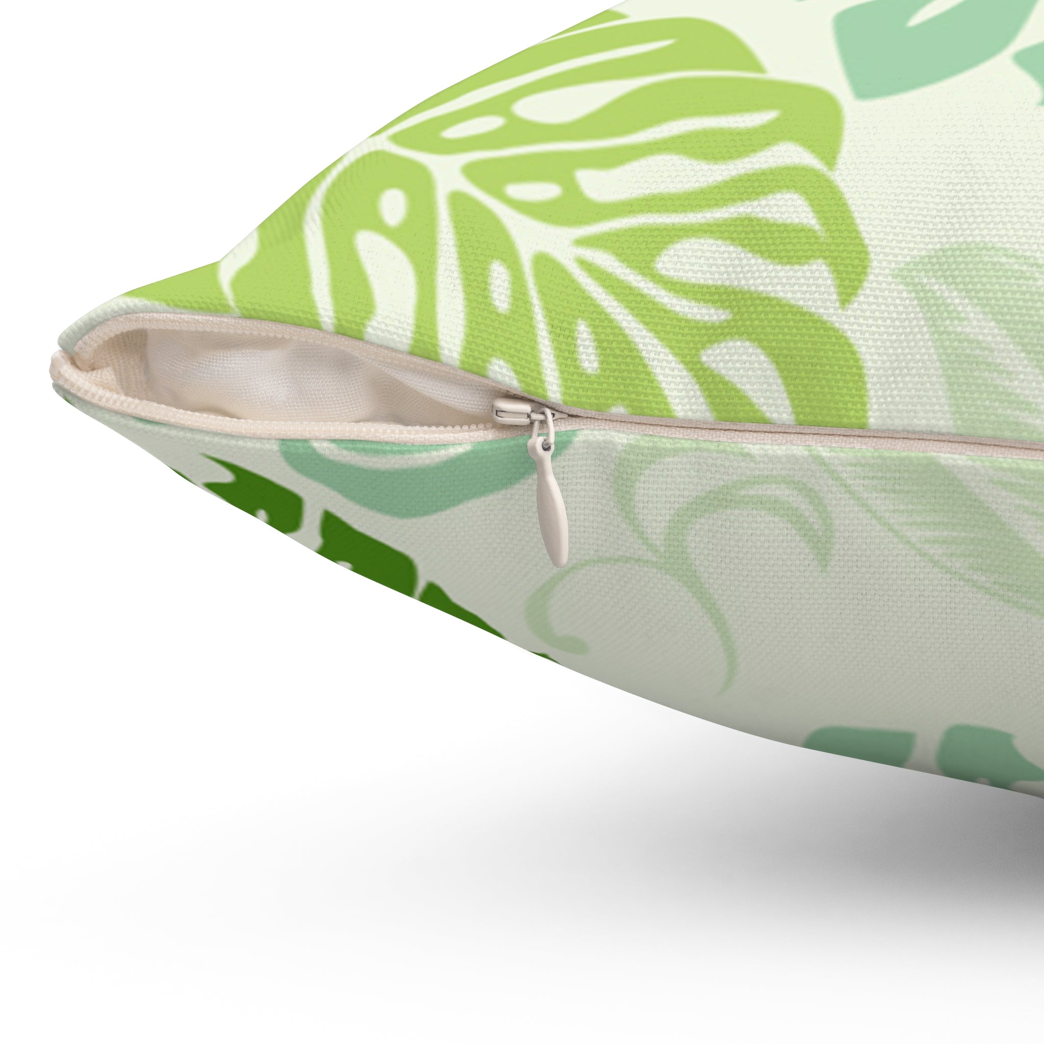 Pouch with green leaf pattern and zipper on a white background