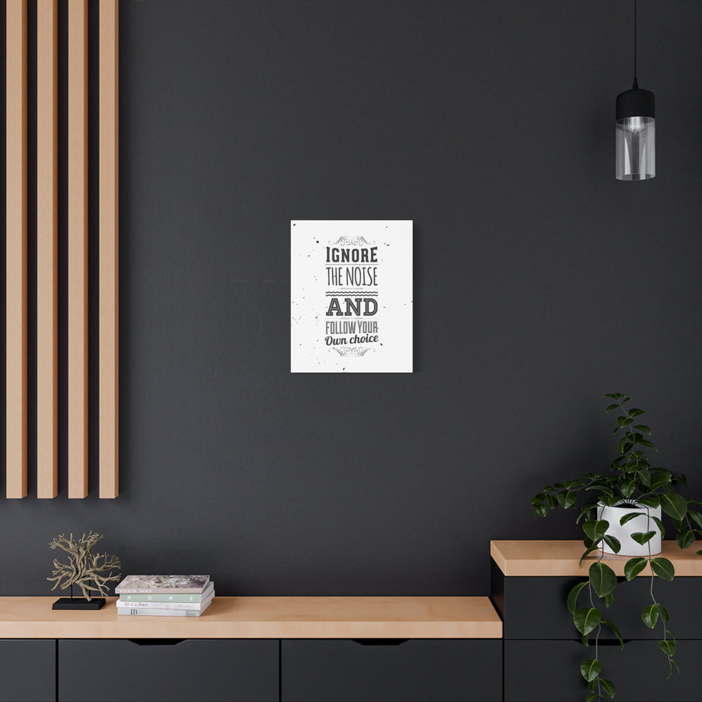 Poster with motivational quote on a dark wall in a modern interior setting.