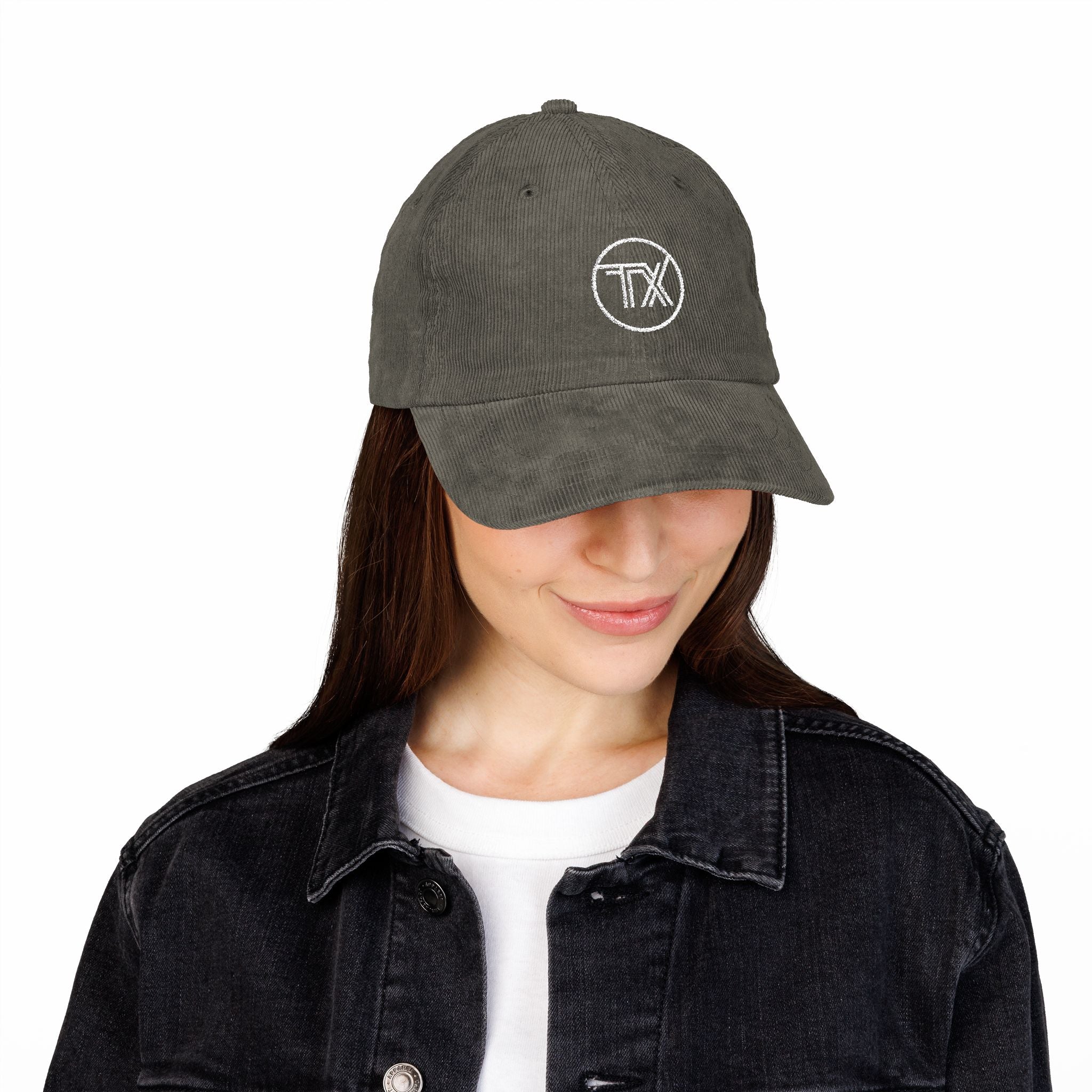 Person wearing a gray cap with a logo on a white background