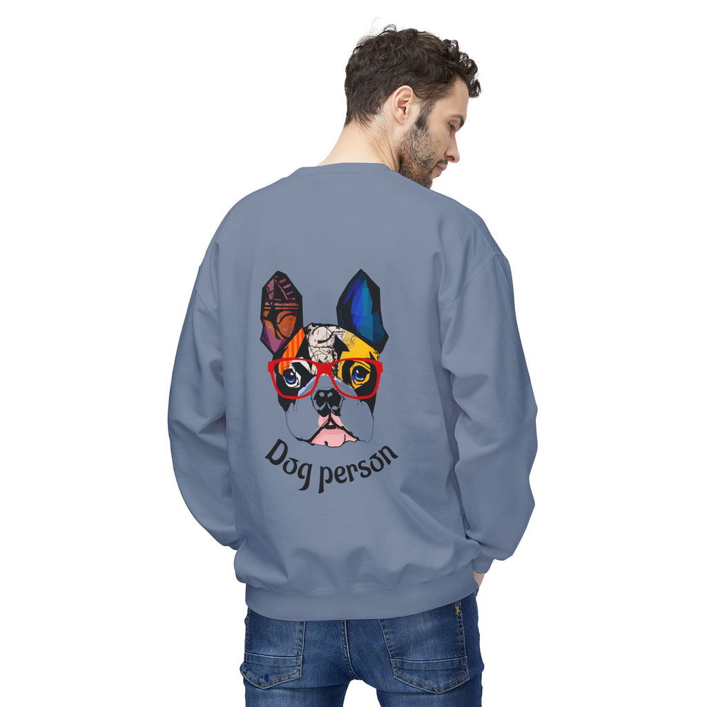 Person wearing a blue sweatshirt with a colorful dog graphic and 'Dog person' text on the back.