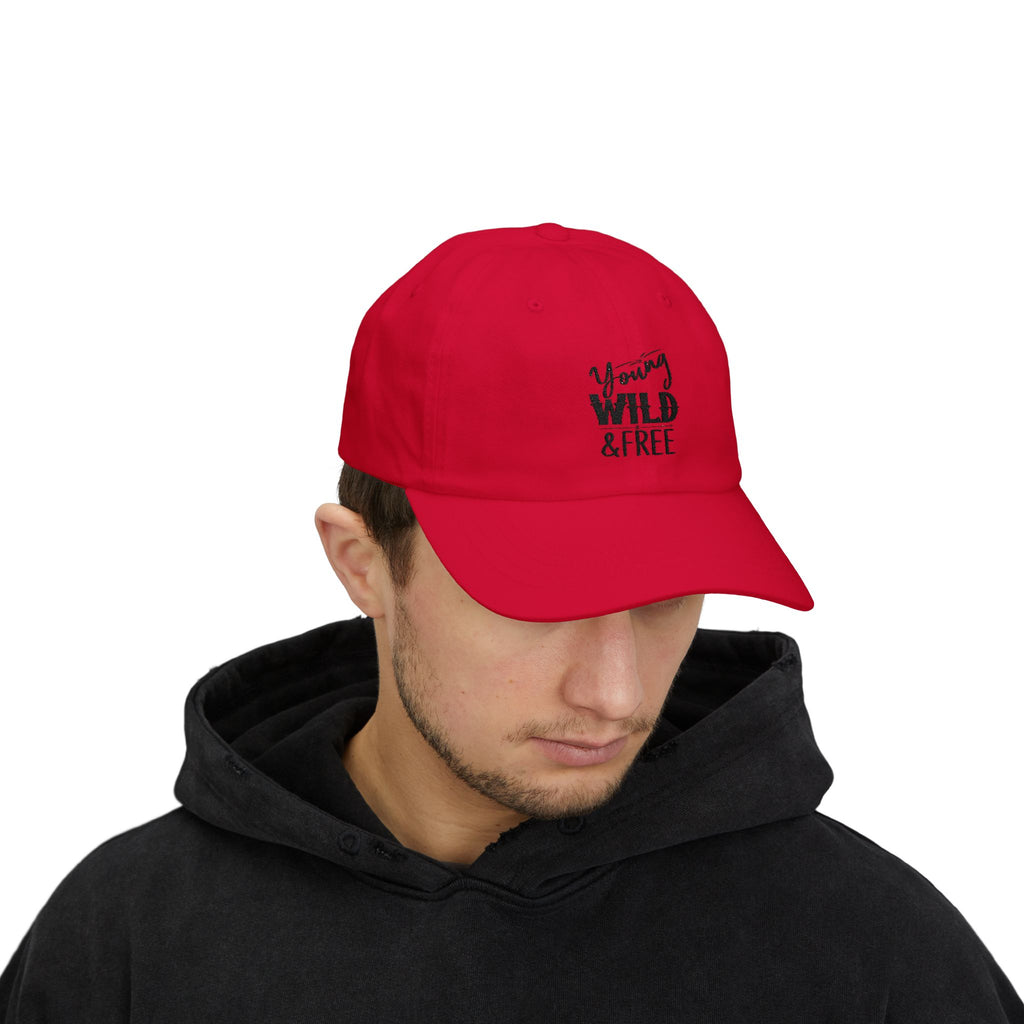 Person wearing a red cap with 'Wild & Free' text on a white background