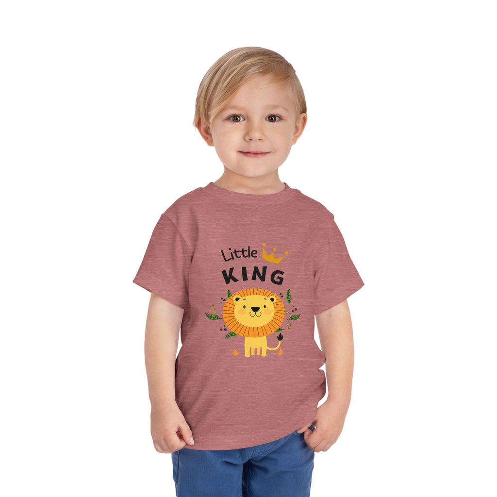 Child wearing a 'Little King' t-shirt with a lion graphic on a white background