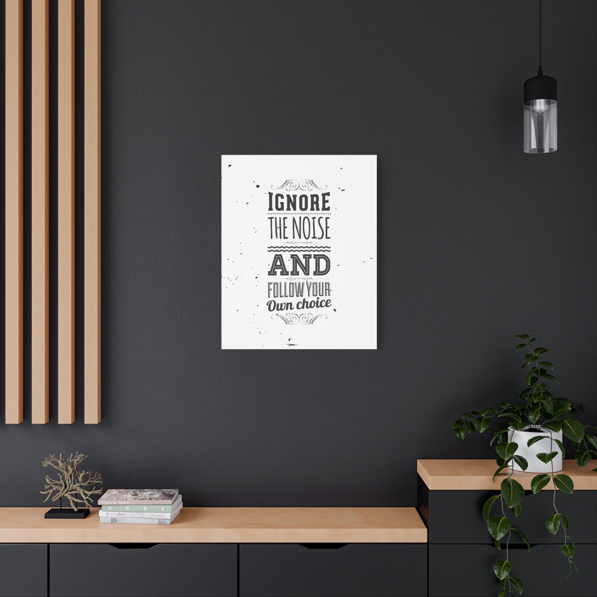 Poster with motivational quote on a dark wall in a modern interior setting