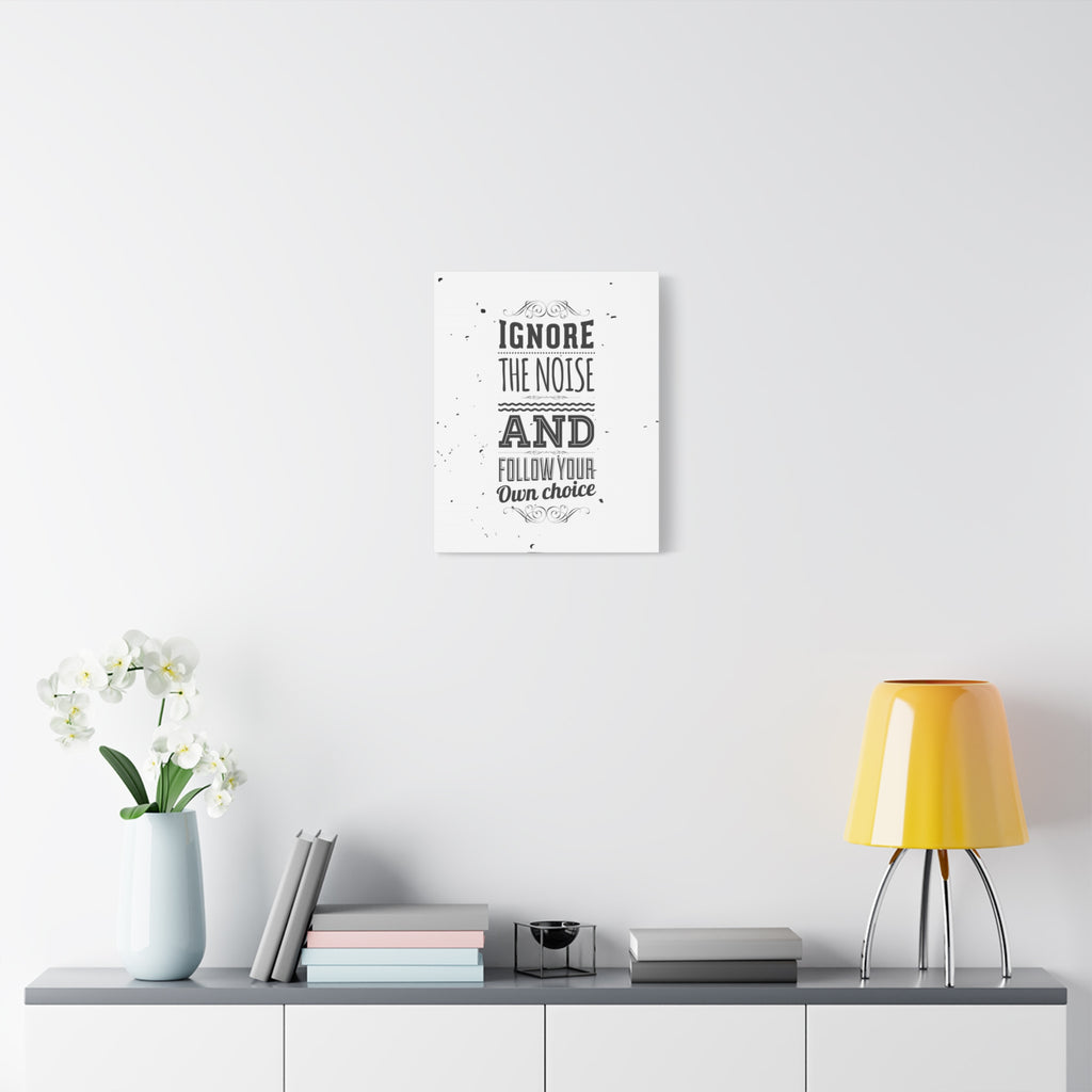 Motivational poster on a wall with decor items below