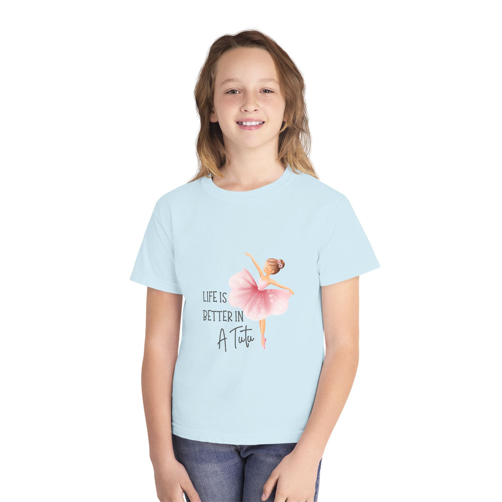 Girl wearing a light blue t-shirt with a graphic and text on a white background