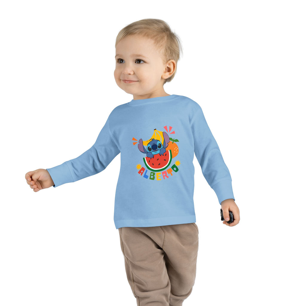 Child wearing a light blue long-sleeve shirt with a colorful design on a white background