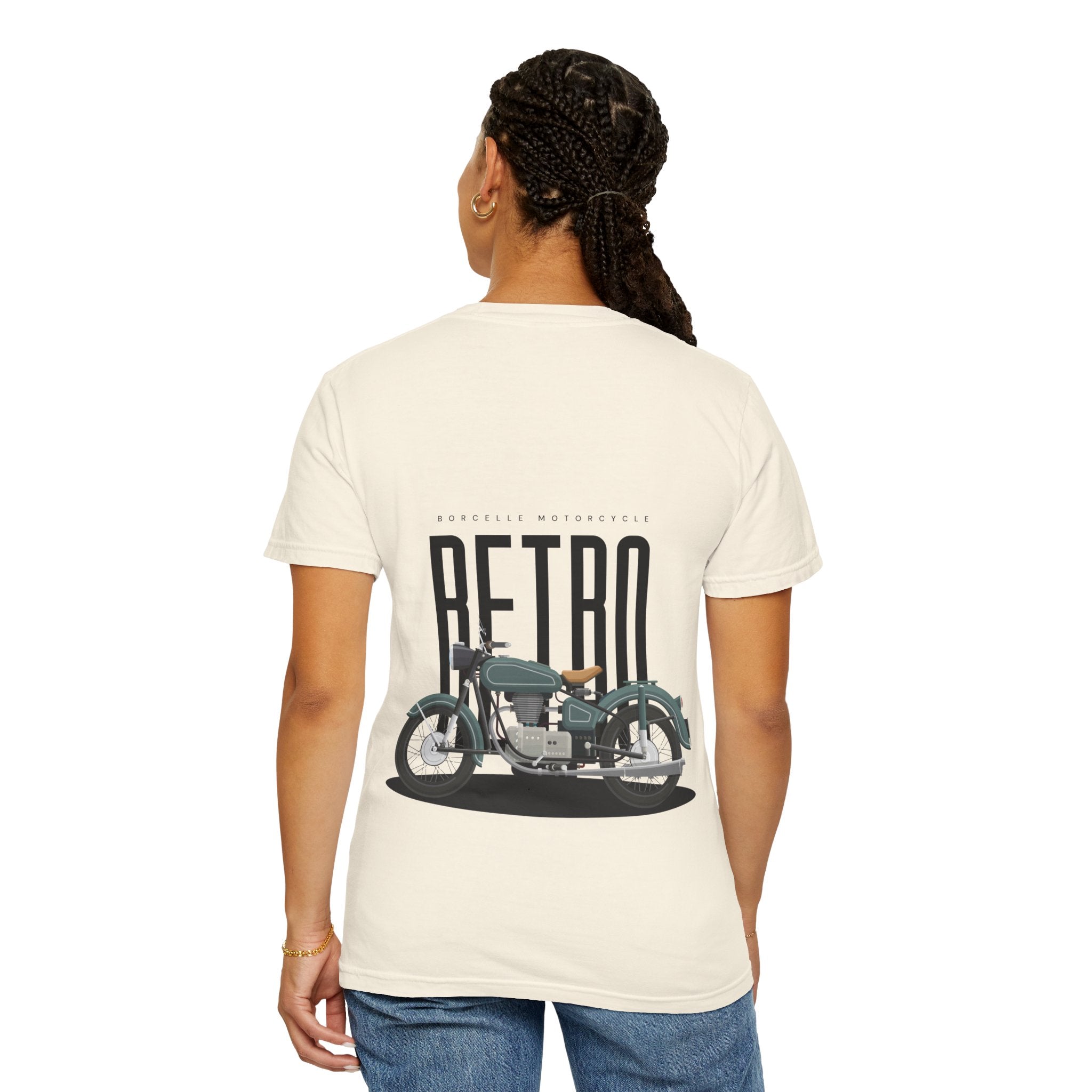 Person wearing a cream t-shirt with a graphic of a vintage motorcycle and the word 'Retro' on the back.
