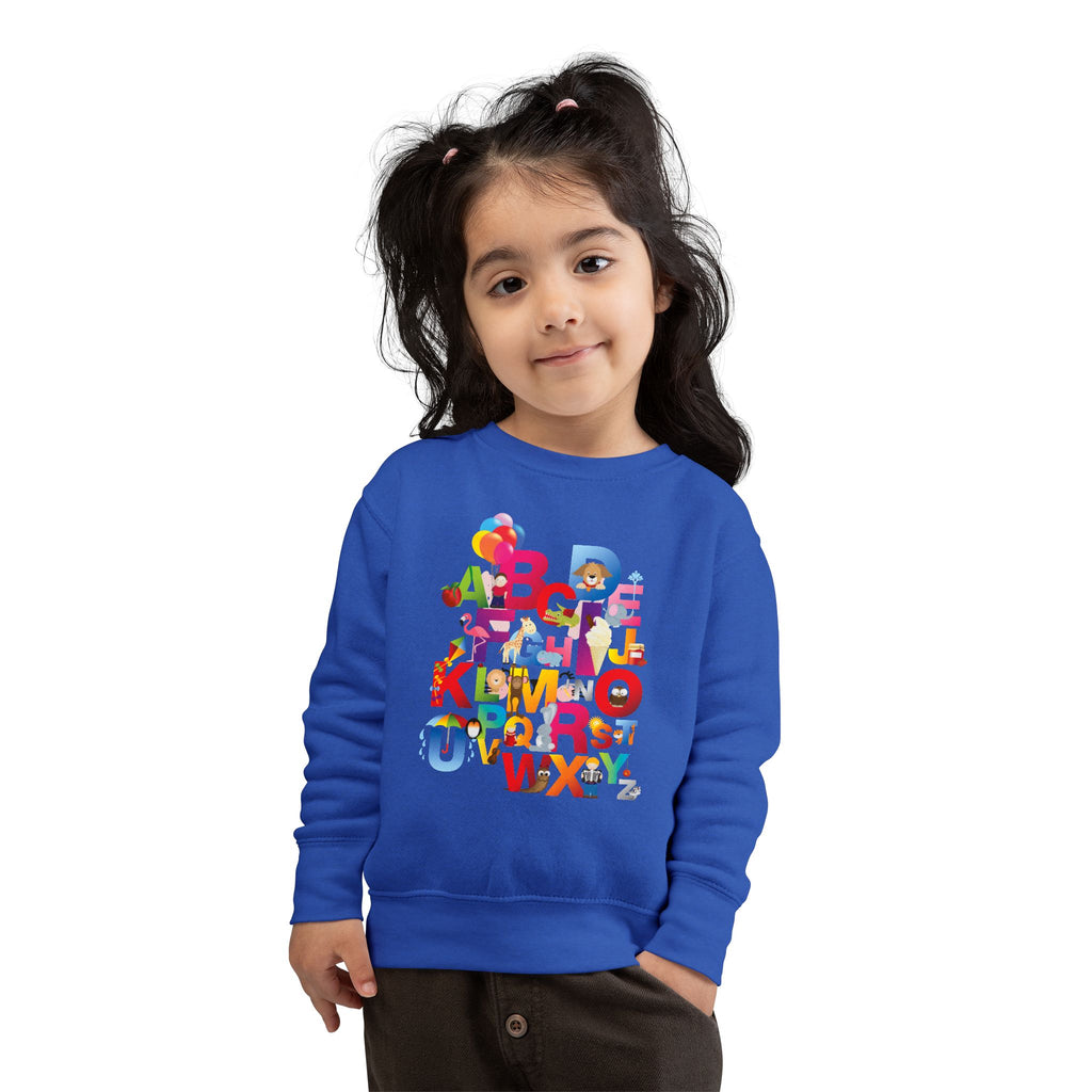 Child wearing a blue sweatshirt with colorful letters and graphics on a white background