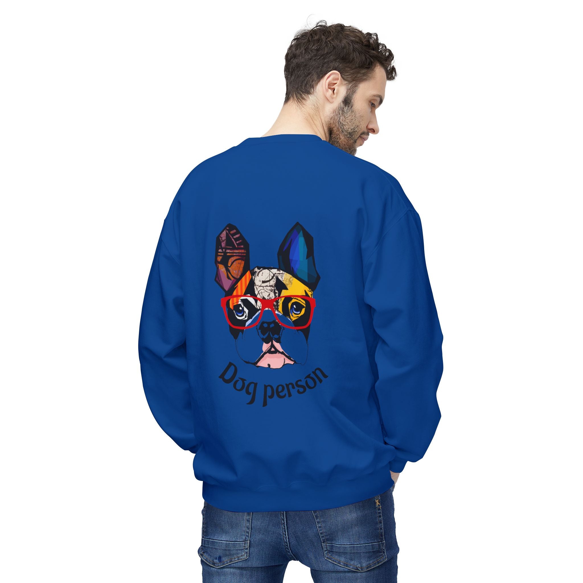 Man wearing a blue sweatshirt with a colorful dog graphic and 'Dog person' text on the back.