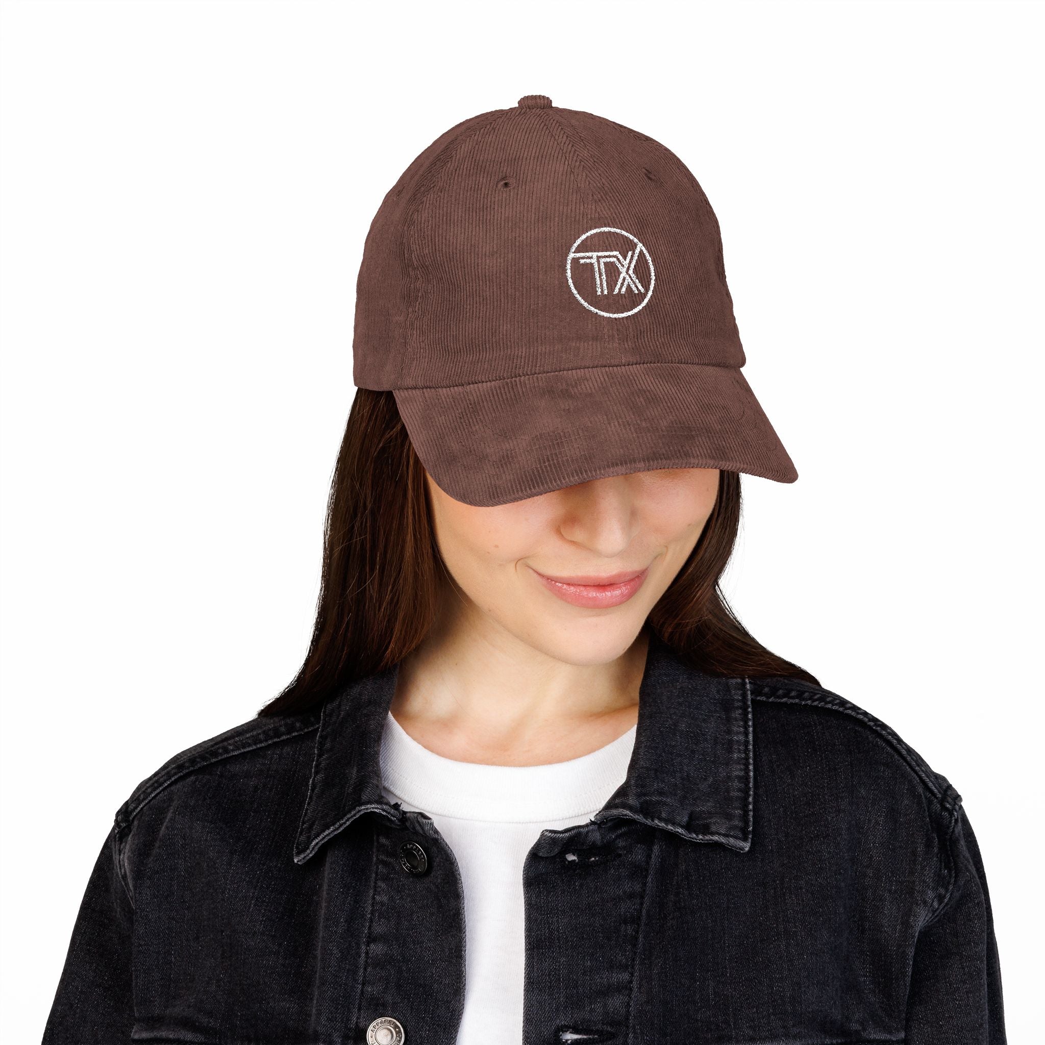 Person wearing a brown cap with a logo on a white background