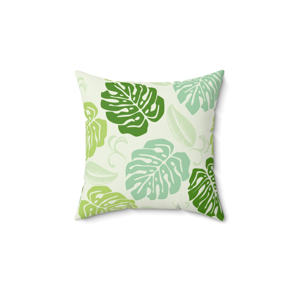 Decorative pillow with green leaf pattern on a white background