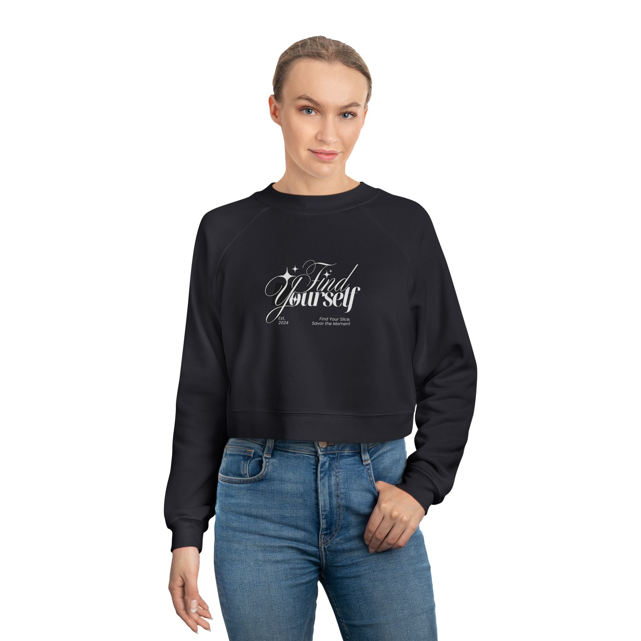 Person wearing a black sweatshirt with text and blue jeans on a white background