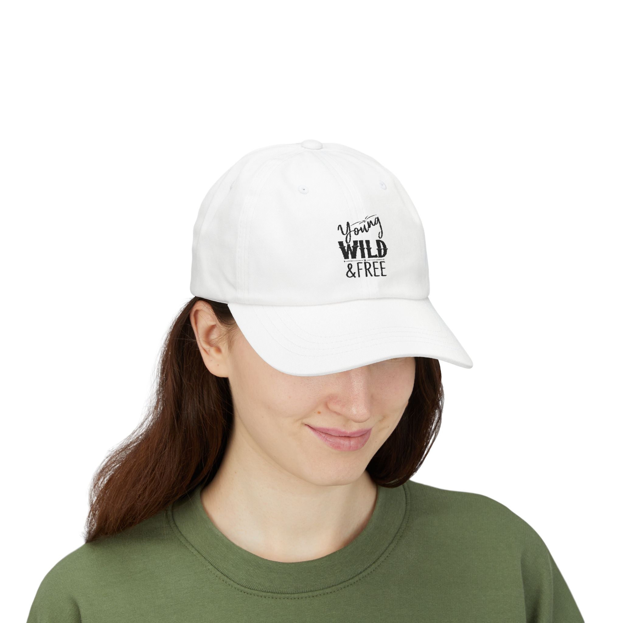 Person wearing a white cap with 'Young Wild & Free' text on a white background