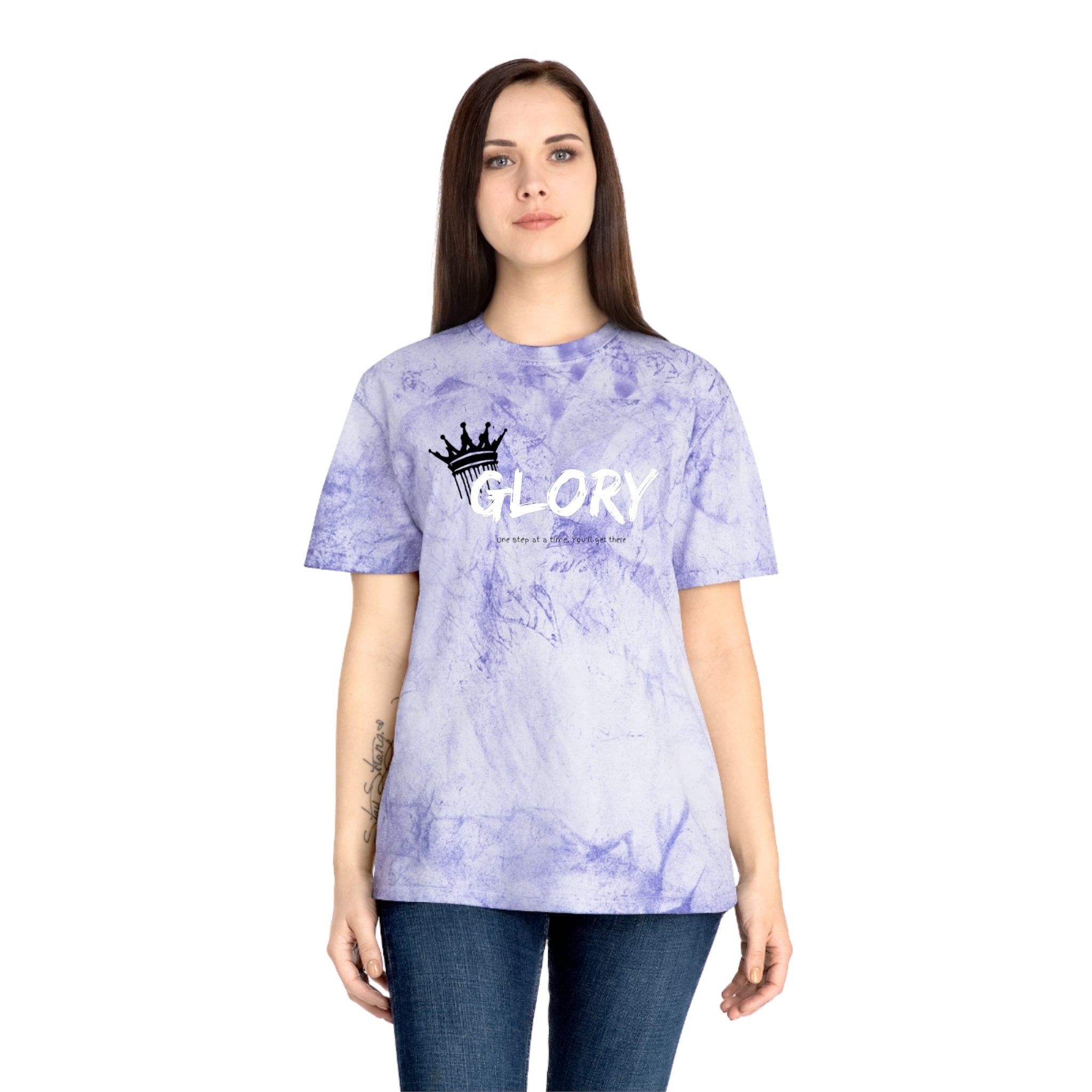 Person wearing a purple tie-dye t-shirt with 'GLORY' text and crown graphic on a white background