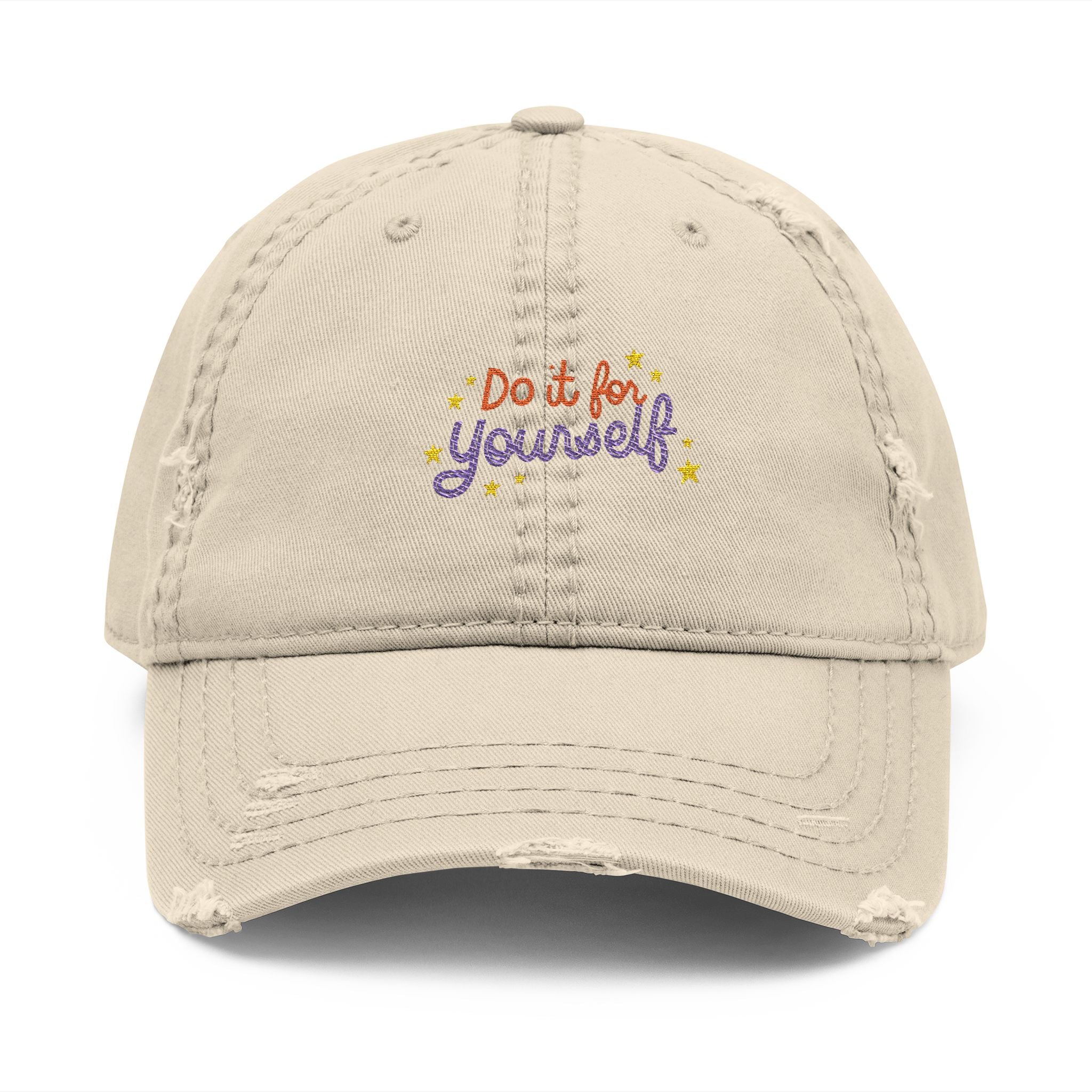 Beige cap with 'Do it for yourself' text on a white background