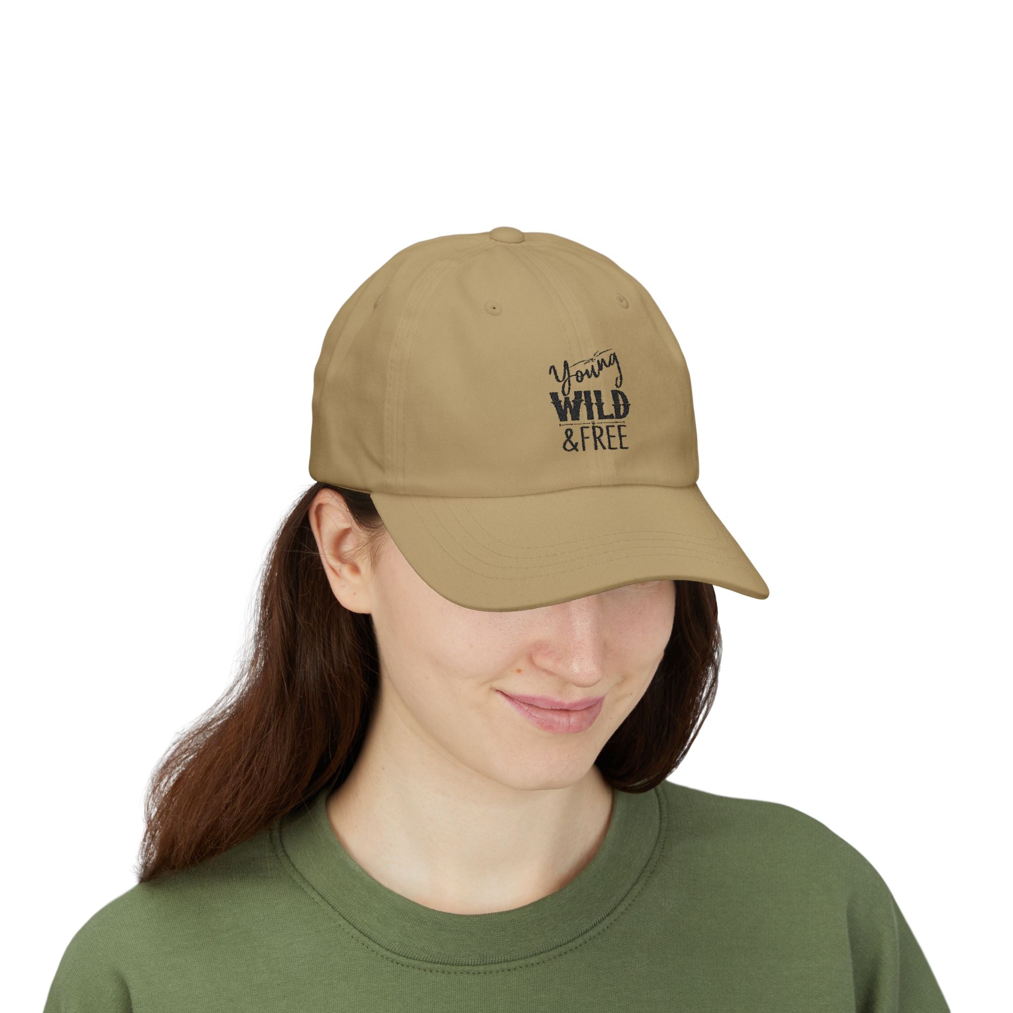 Person wearing a beige cap with 'Young Wild & Free' text on a white background