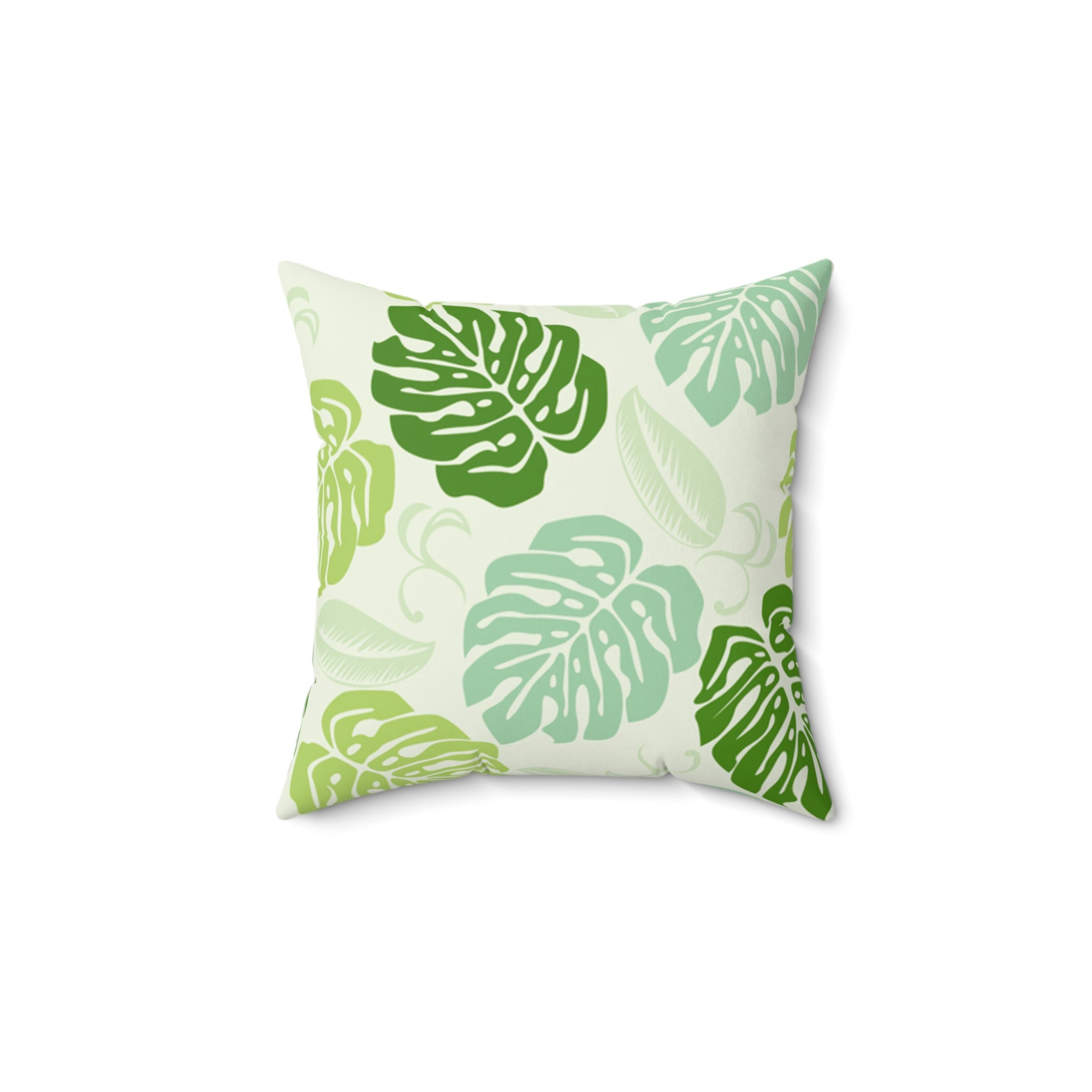 Decorative pillow with green leaf pattern on a white background