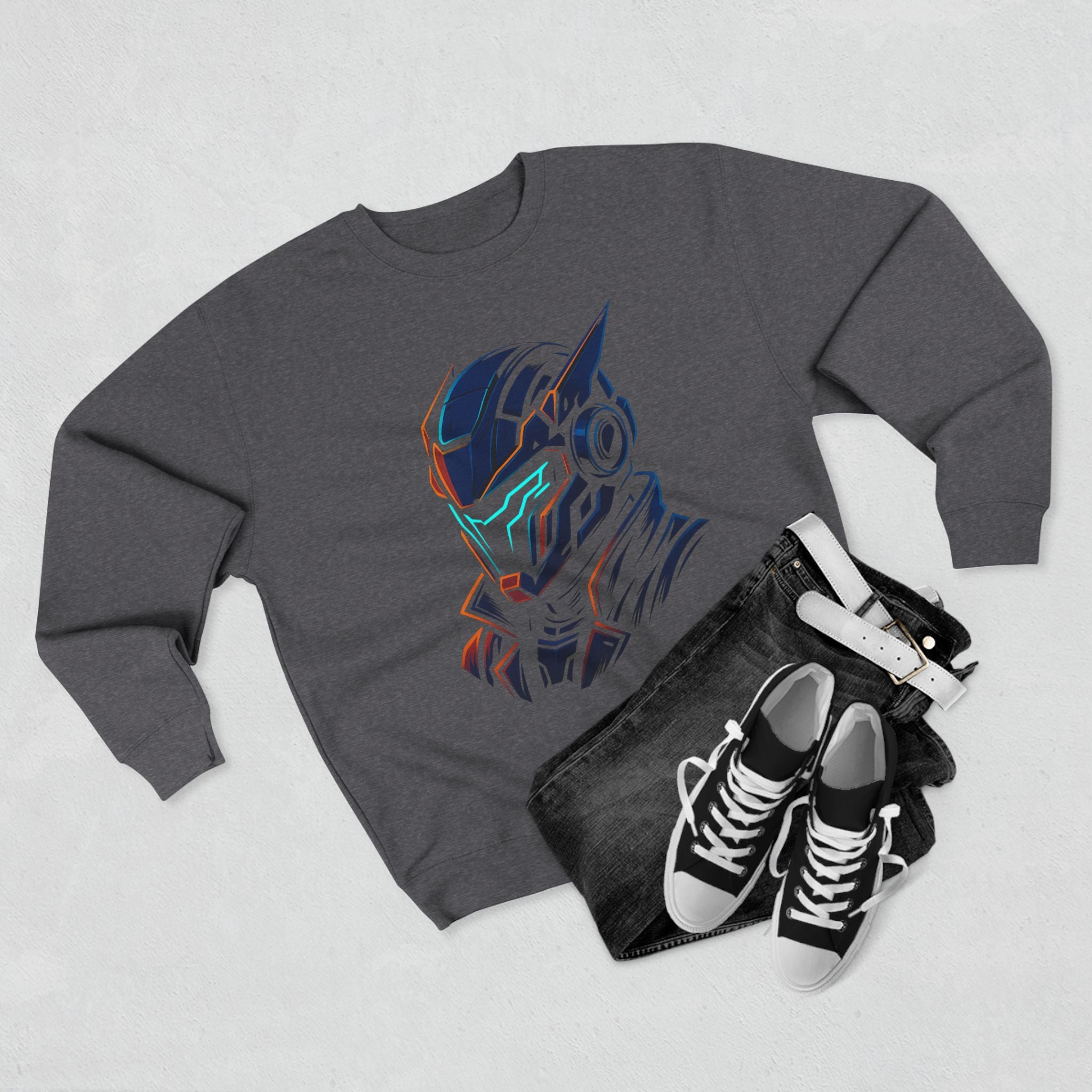 Gray sweatshirt with a colorful graphic design, black jeans, and black sneakers on a light gray background