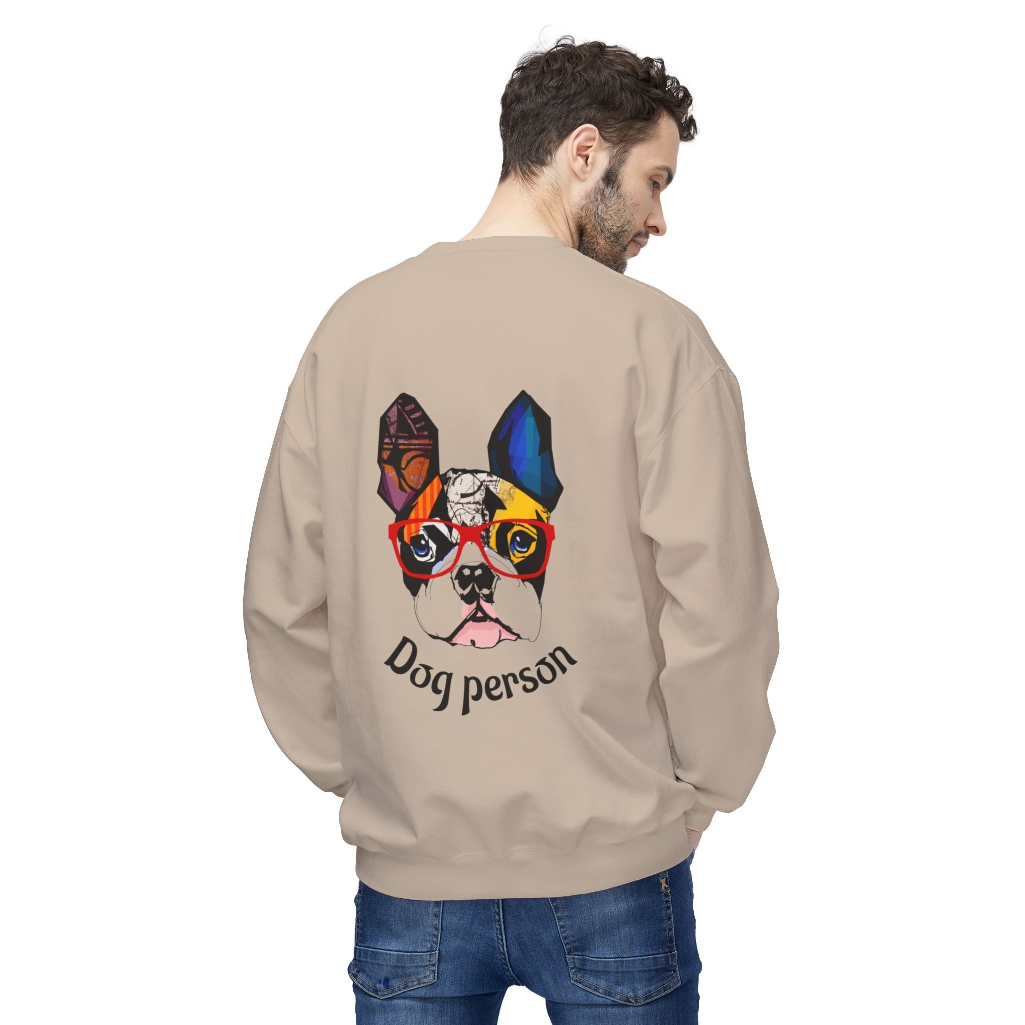 Man wearing a beige sweatshirt with a colorful dog graphic and 'Dog person' text on the back.