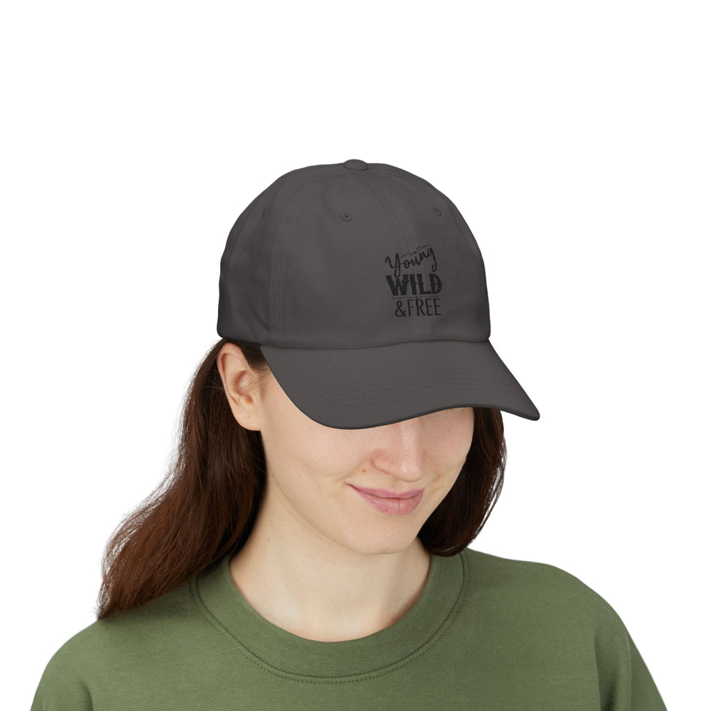 Person wearing a gray cap with 'Young Wild & Free' text on a white background